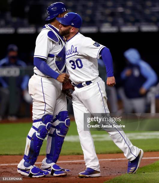 Salvador Perez and Danny Duffy of the Kansas City Royals celebrate after a double play with the bases loaded during the 6th inning of the game...