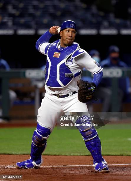 Catcher Salvador Perez of the Kansas City Royals throws toward first base after stepping on home plate with the bases loaded for a double play during...