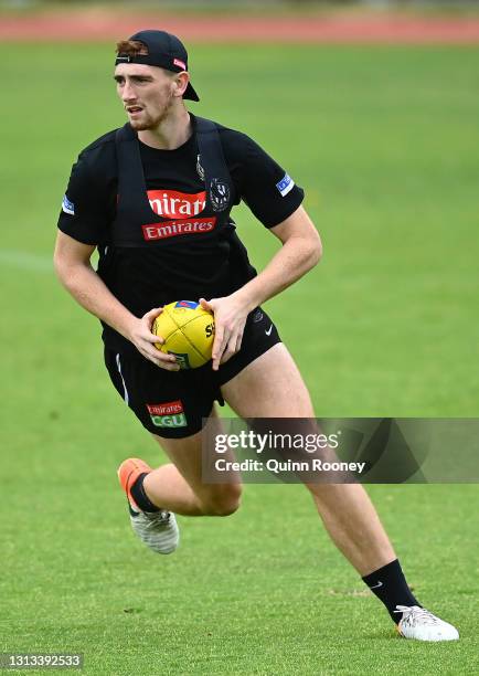 Mark Keane of the Magpies looks to pass the ball during a Collingwood Magpies AFL training session at the Holden Centre on April 20, 2021 in...