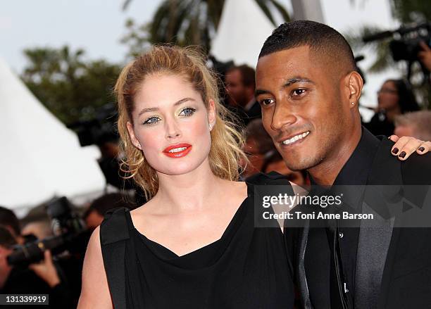 Model Doutzen Kroes and Sunnery James attends the "La Conquete" Premiere during the 64th Annual Cannes Film Festival at the Palais des Festivals on...