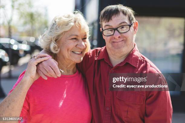 volwassen man portret met een downsyndroom fotoserie - intellectually disabled stockfoto's en -beelden