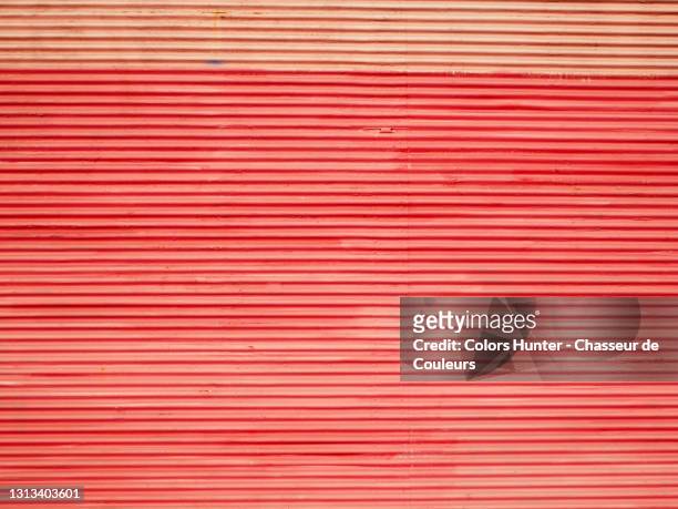 corrugated and patinated metal roller shutter in paris - roller shutter stock pictures, royalty-free photos & images