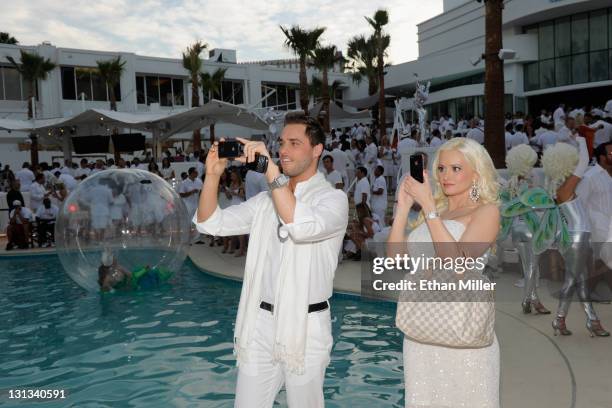 Singer Josh Strickland and model and television personality Holly Madison attend the Nikki Beach Grand Opening White Party at Tropicana Las Vegas on...