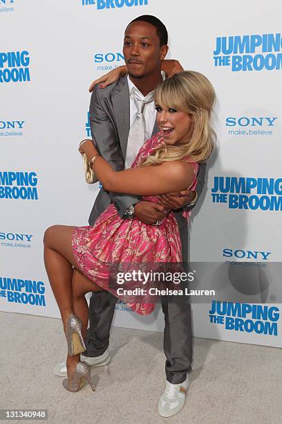 Actor/singer Romeo Miller and dancer Chelsie Hightower arrive at the Los Angeles premiere of "Jumping The Broom" at ArcLight Cinemas Cinerama Dome on...