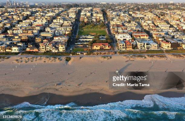 In an aerial view, Bruce's Beach is wedged between expensive real estate on April 19, 2021 in Manhattan Beach, California. The beachfront property...