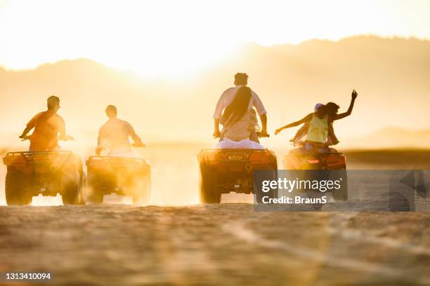 driving quad bikes in the desert! - egypt desert stock pictures, royalty-free photos & images