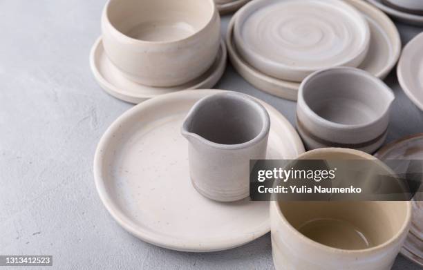 ceramic tableware, craft plates - dining room set stock pictures, royalty-free photos & images