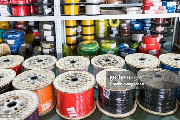 wires or cables are at the factory in the warehouse - cable spool stock pictures, royalty-free photos & images