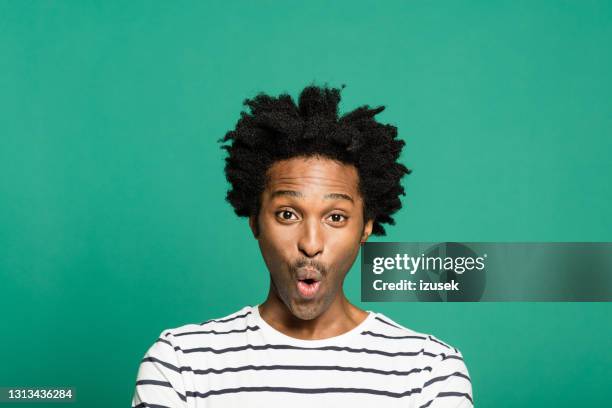 headshot of surprised afro american man - curly hair man stock pictures, royalty-free photos & images