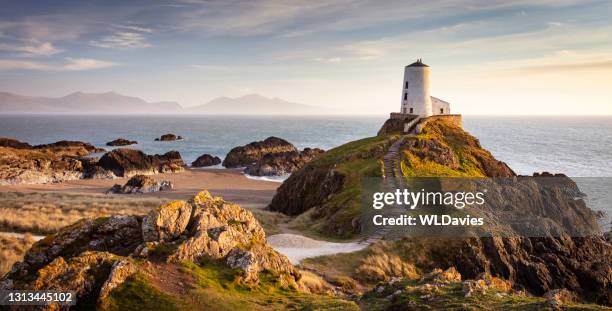 north wales coastline - lighthouse sunset stock pictures, royalty-free photos & images