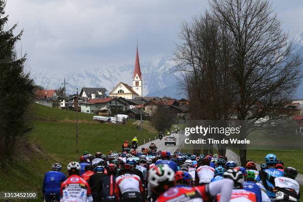 The Peloton passing through Flaurling Village during the 44th Tour of the Alps 2021, Stage 2 a 121,5km stage from Innsbruck to Feichten im Kaunertal...