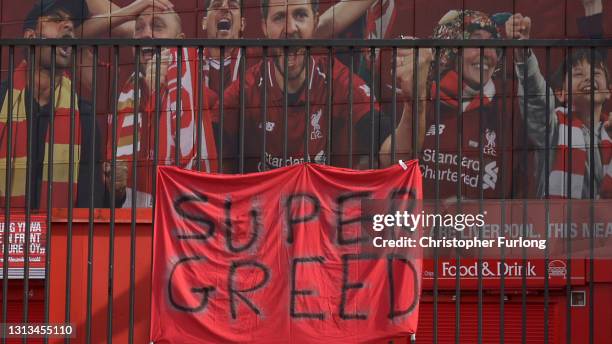 Banners and football scarves are tied to the fences around Anfield Stadium, the home of Liverpool Football Club, in protest at the club's intentions...