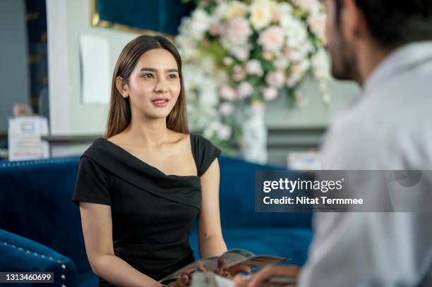 asian female customer talking with dermatologists about skin care treatment in the beauty clinic. skin care clinic business. - dermatologists talking to each other patient stock pictures, royalty-free photos & images