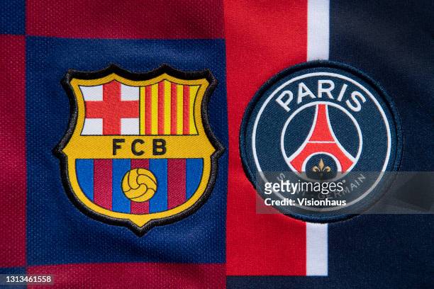 The club badges of FC Barcelona and Paris Saint-Germain on their first team home shirts ahead of their UEFA Women's Champions League semi final on...