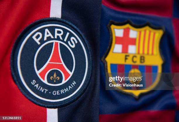 The club badges of Paris Saint-Germain and FC Barcelona on their first team home shirts ahead of their UEFA Women's Champions League semi final on...