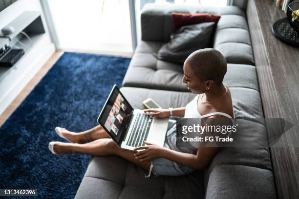 Young woman doing a video call on laptop at home
