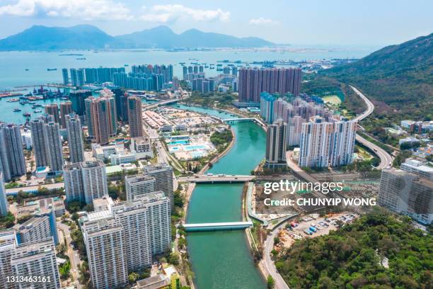 drone view of downtown cityscape in tuen mun, hong kong - tuen mun stock pictures, royalty-free photos & images