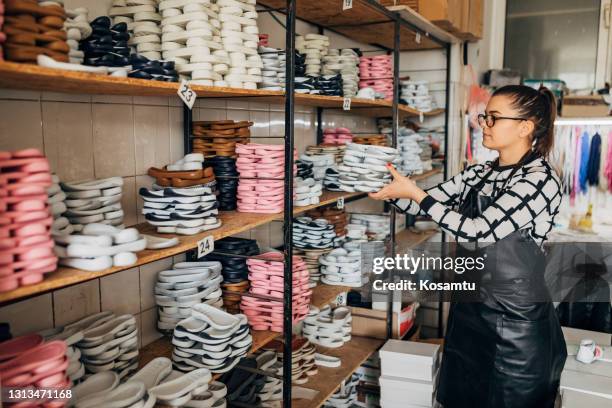 kids shoe designer observing and choosing the sole of shoe, so she can start with the next production process - sole of shoe stock pictures, royalty-free photos & images