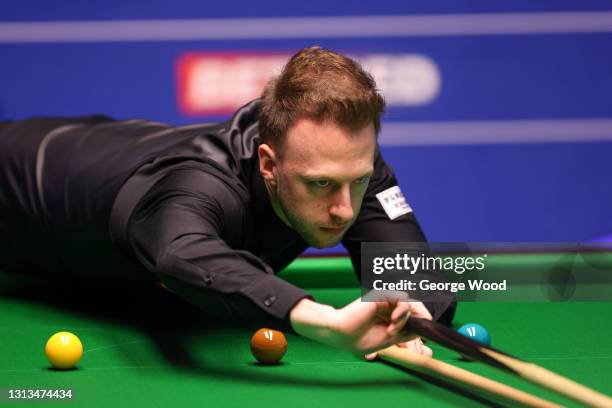 Judd Trump of England plays a shot during the Betfred World Snooker Championship Round One match between Liam Highfield of England and Judd Trump of...