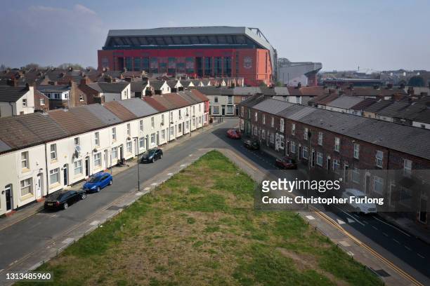 In an aerial view, terraced homes surround Anfield stadium, the home of Liverpool Football Club, after the club disclosed its intentions to join the...