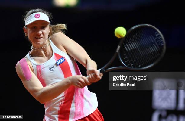 Mona Barthel of Germany returns a backhand during the match on day 4 of the Porsche Tennis Grand Prix between Laura Siegemund of Germany and Mona...