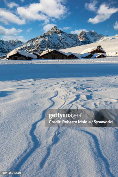 snowy mountains and huts, alpe prabello, valtellina, italy - sondrio fotografías e imágenes de stock