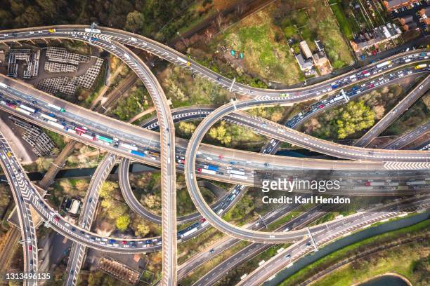 an aerial view of an english motorway - stock photo - commuters overhead view stock-fotos und bilder