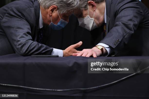 Senate Appropriations Committee members Sen. John Hoeven and Sen. John Kennedy talk during a committee hearing in the Dirksen Senate Office Building...