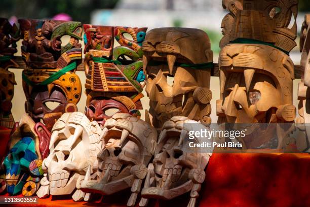 chichen itza mayan handcrafted wooden masks in yucatan mexico - azteca fotografías e imágenes de stock