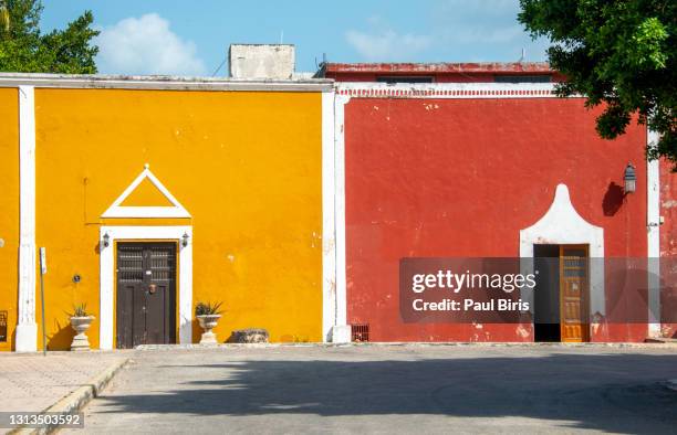 colonial building with wooden door, valladolid, yucatan, mexico - mexico wall stock pictures, royalty-free photos & images