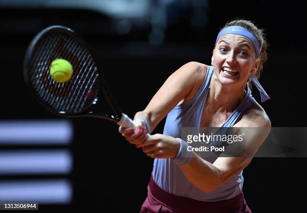 Petra Kvitova of Czech Republic plays a backhand during the match on day 4 of the Porsche Tennis Grand Prix between Jennifer Brady of the United...
