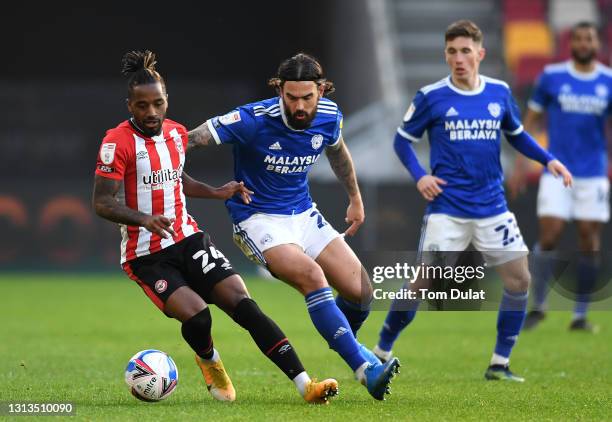 Tariqe Fosu of Brentford and Marlon Pack of Cardiff City during the Sky Bet Championship match between Brentford and Cardiff City at Brentford...