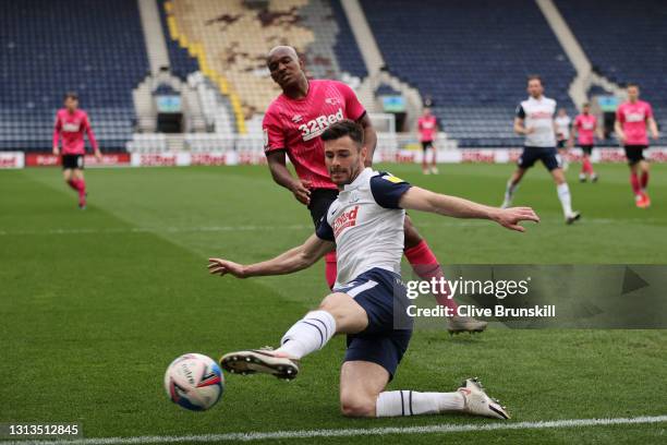 Andrew Hughes of Preston North End and Andre Wisdom of Derby County battle for the ball during the Sky Bet Championship match between Preston North...