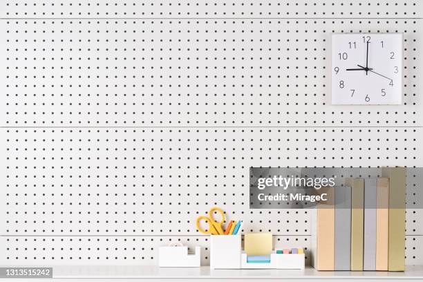 book and stationary on shelf - tidy desk stock pictures, royalty-free photos & images