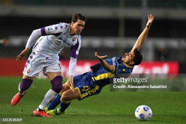Dusan Vlahovic of ACF Fiorentina and Koray Guenter of Hellas Verona F.C. Battle for the ball during the Serie A match between Hellas Verona FC and...