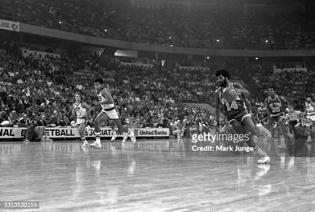 New York Knicks guard Ticky Burden races Denver Nuggets guard Chuck Williams downcourt during an NBA basketball game at McNichols Arena on November...