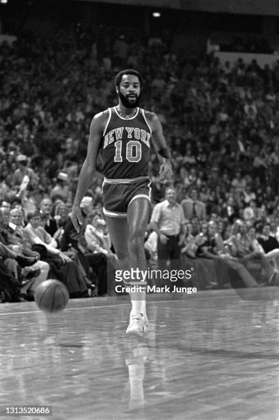 New York Knicks guard Walt Frazier dribbles in the frontcourt during an NBA basketball game against the Denver Nuggets at McNichols Arena on November...