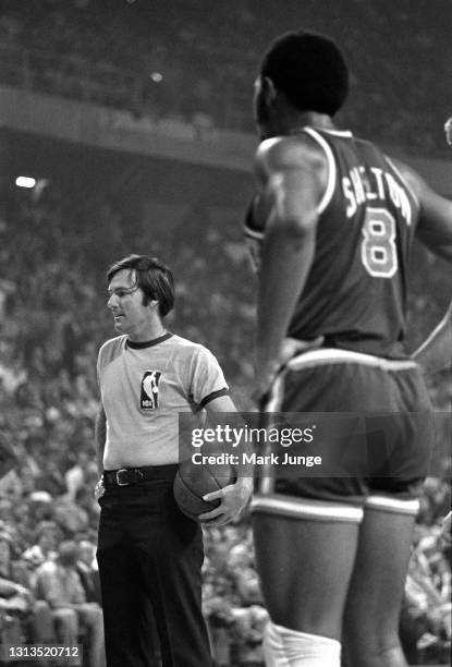 Referee Jake O’Donnell holds the ball at the free throw line during an NBA basketball game between the New York Knicks and the Denver Nuggets at...