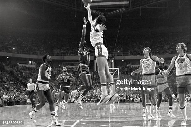 Denver Nuggets forward Bobby Jones blocks a layup attempt by New York Knicks guard Earl “the pearl” Monroe during an NBA basketball game against the...