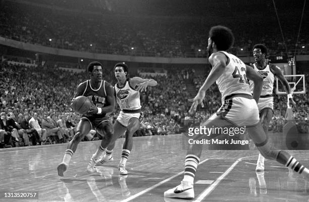 New York Knicks guard Mo Layton drives toward the basket past Denver Nuggets guard Chuck Williams during an NBA basketball game at McNichols Arena on...