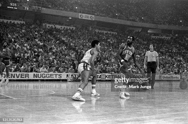 New York Knicks guard Earl “the pearl” Monroe downcourt against Denver Nuggets guard Chuck Williams during an NBA basketball game against the Denver...