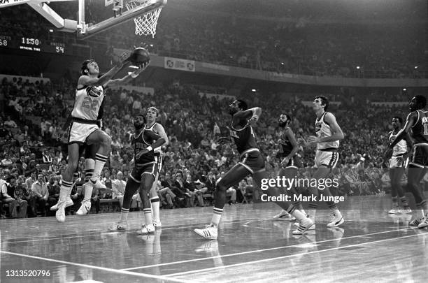 Denver Nuggets forward Gus Gerard goes up for a reverse layup during an NBA basketball game against the New York Knicks at McNichols Arena on...