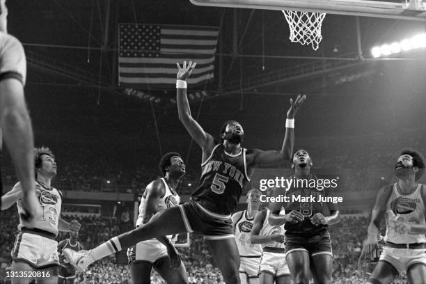 New York Knicks forward Jim McMillian jumps for a rebound during an NBA basketball game against the Denver Nuggets at McNichols Arena on November 3,...