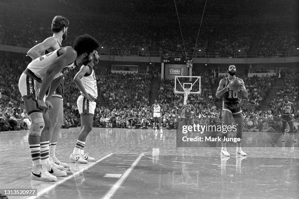 New York Knicks guard Walt Frazier shoots a free throw during an NBA basketball game against the Denver Nuggets at McNichols Arena on November 3,...
