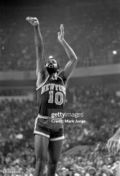 New York Knicks guard Walt Frazier takes a jump shot during an NBA basketball game against the Denver Nuggets at McNichols Arena on November 3, 1976...