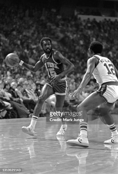 New York Knicks guard Earl “the pearl” Monroe tries to dribble past guard Ted McClain during an NBA basketball game against the Denver Nuggets at...