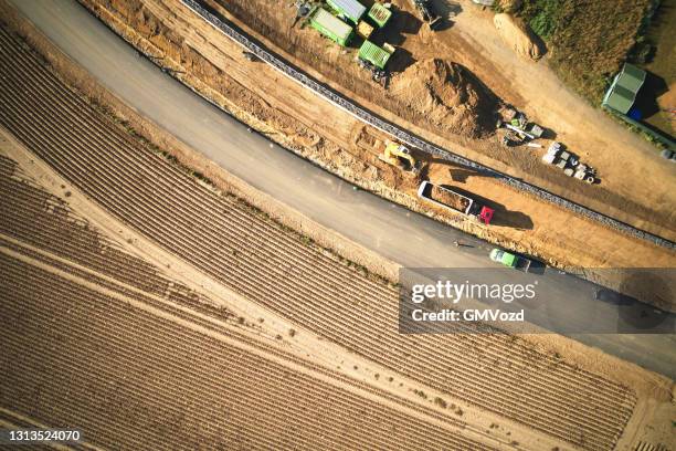 drone aerial view on a construction work on round about - elevated road stock pictures, royalty-free photos & images