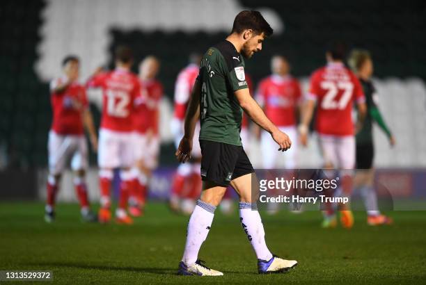 Joe Edwards of Plymouth Argyle reacts as Chuks Aneke of Charlton Athletic celebrates after scoring their sides sixth goal during the Sky Bet League...