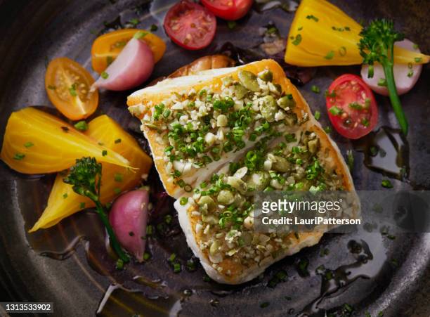 pan seared halibut with pumpkin seed gremolata - cod dinner stock pictures, royalty-free photos & images