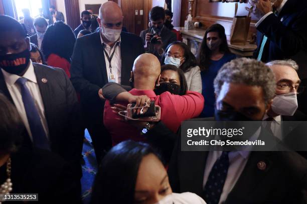 Rep. Cori Bush embraces Rep. Ayanna Pressley as members of the Congressional Black Caucus react to the verdict in the Derek Chauvin murder trial in...